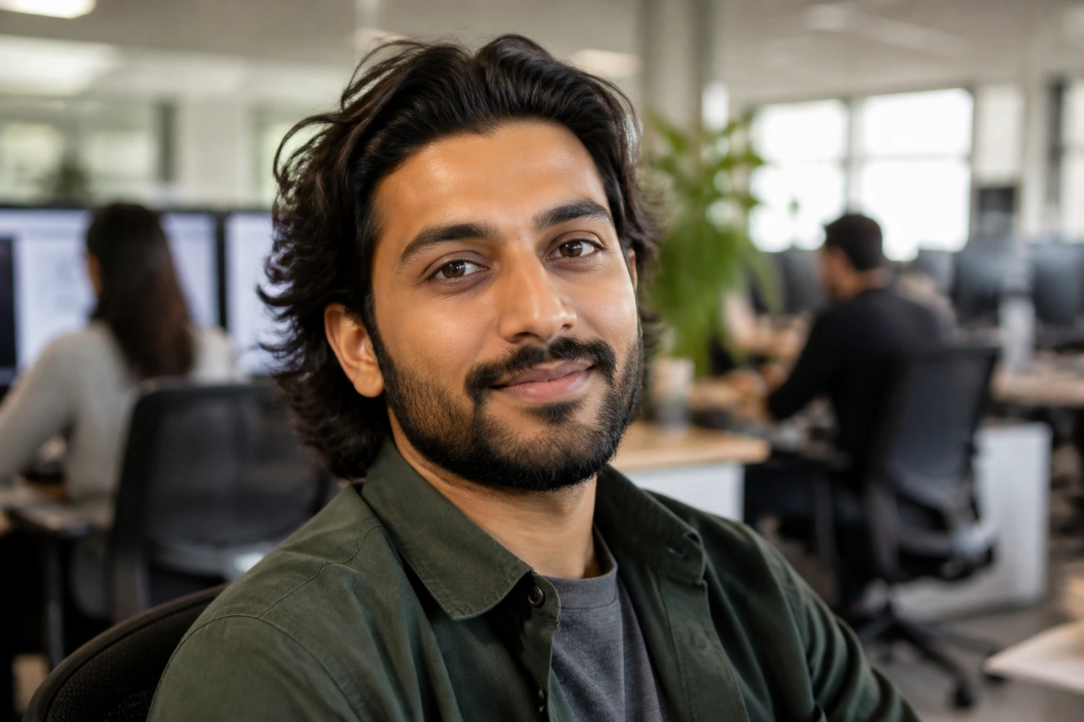 Close-up portrait of an Adobe software engineer in a bright office
