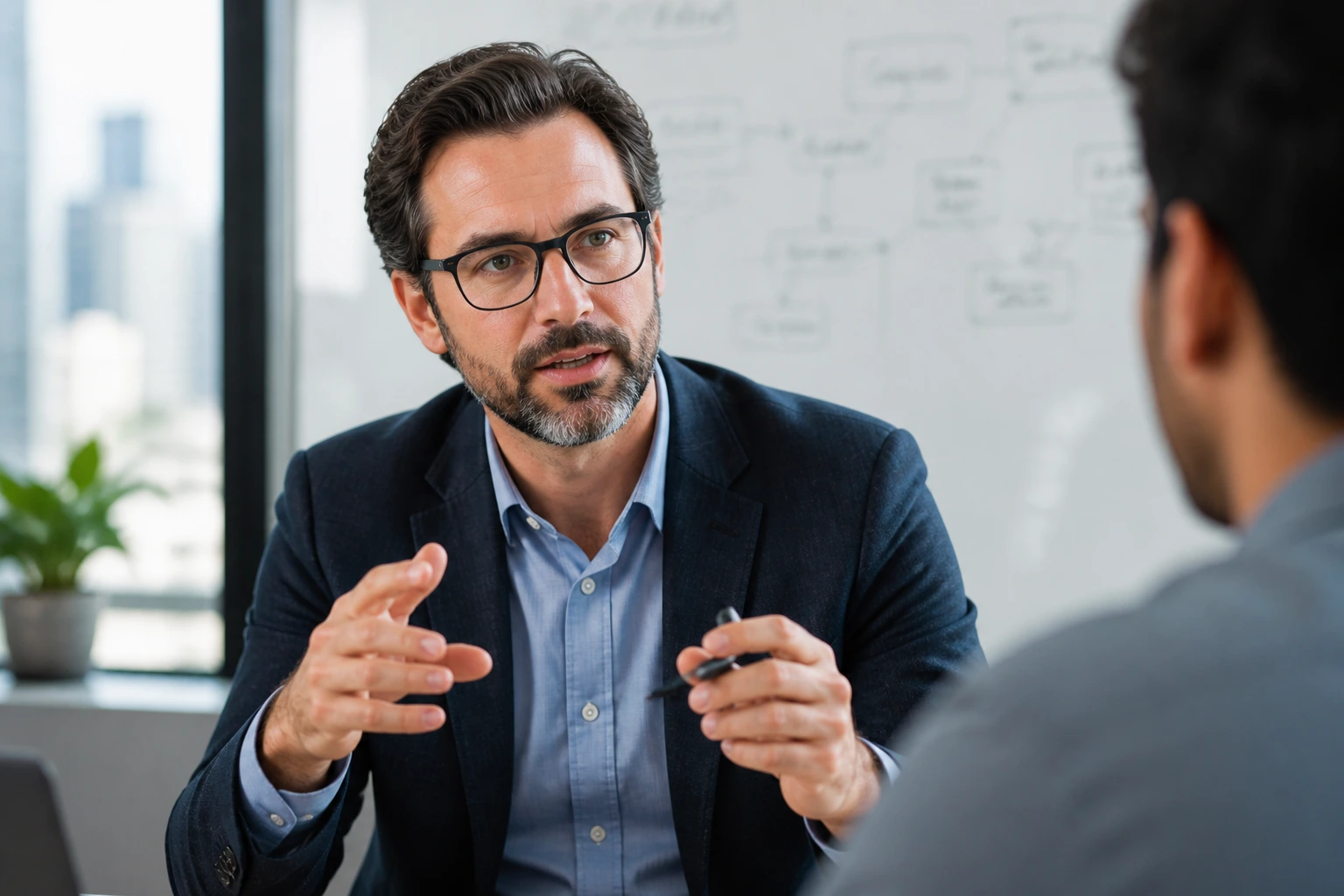 Close-up of a real AI architect explaining a system design in a bright office.