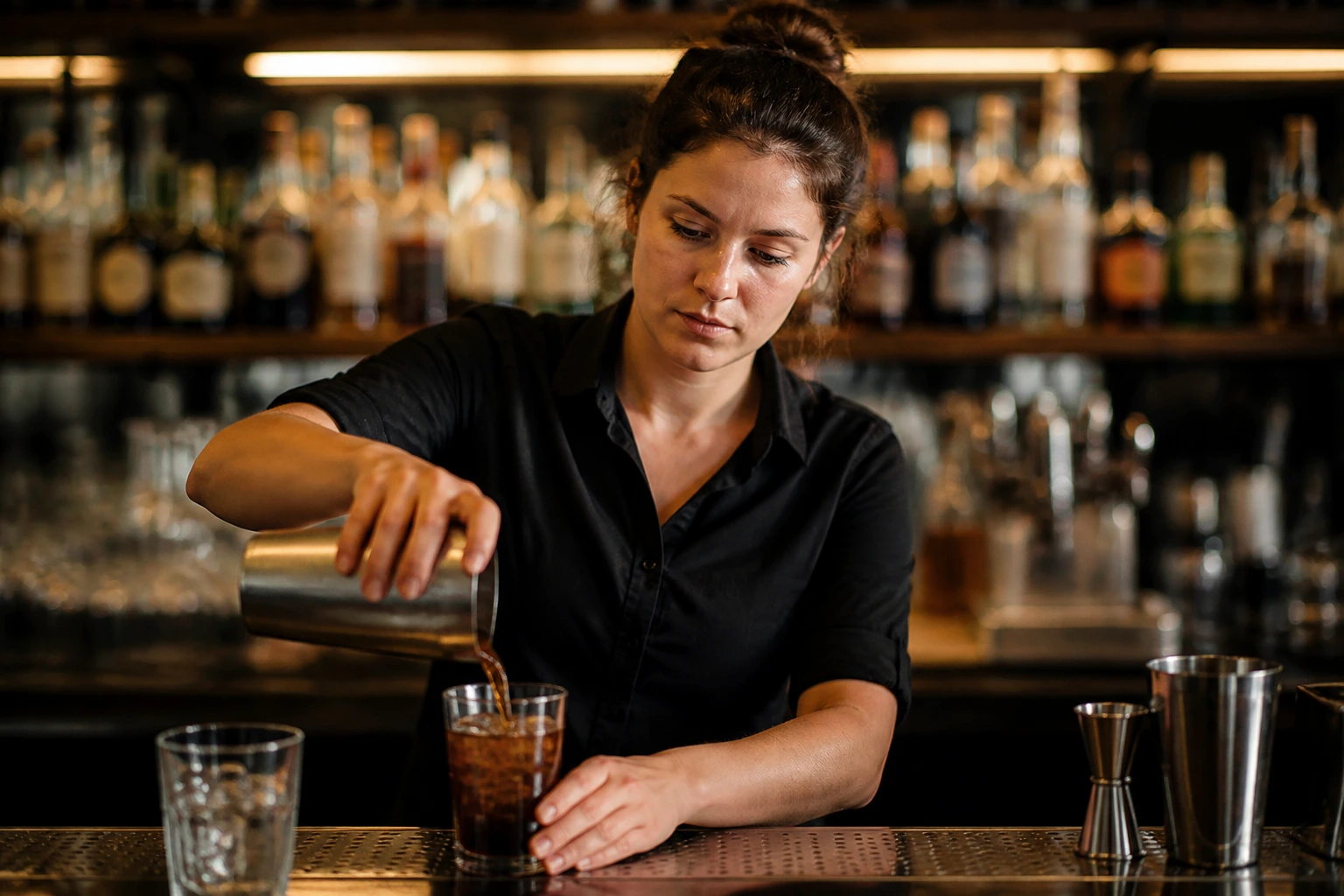 Medium close-up of a bartender in a pub setting