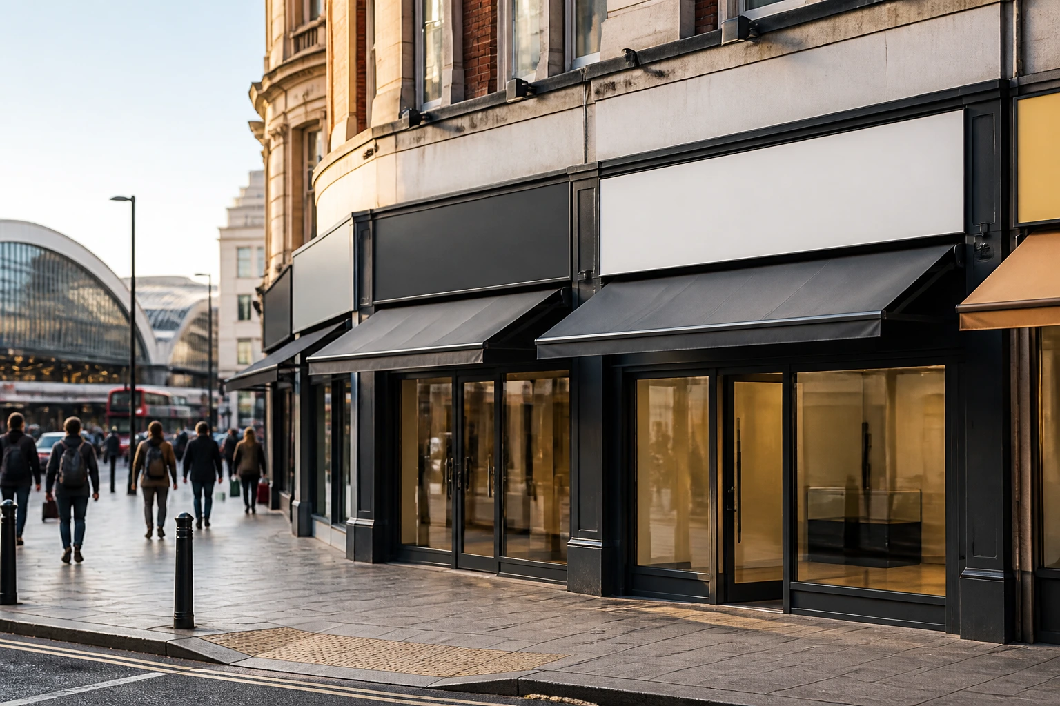 Row of unmarked storefronts on a UK city street, illustrating clustered fast-food openings