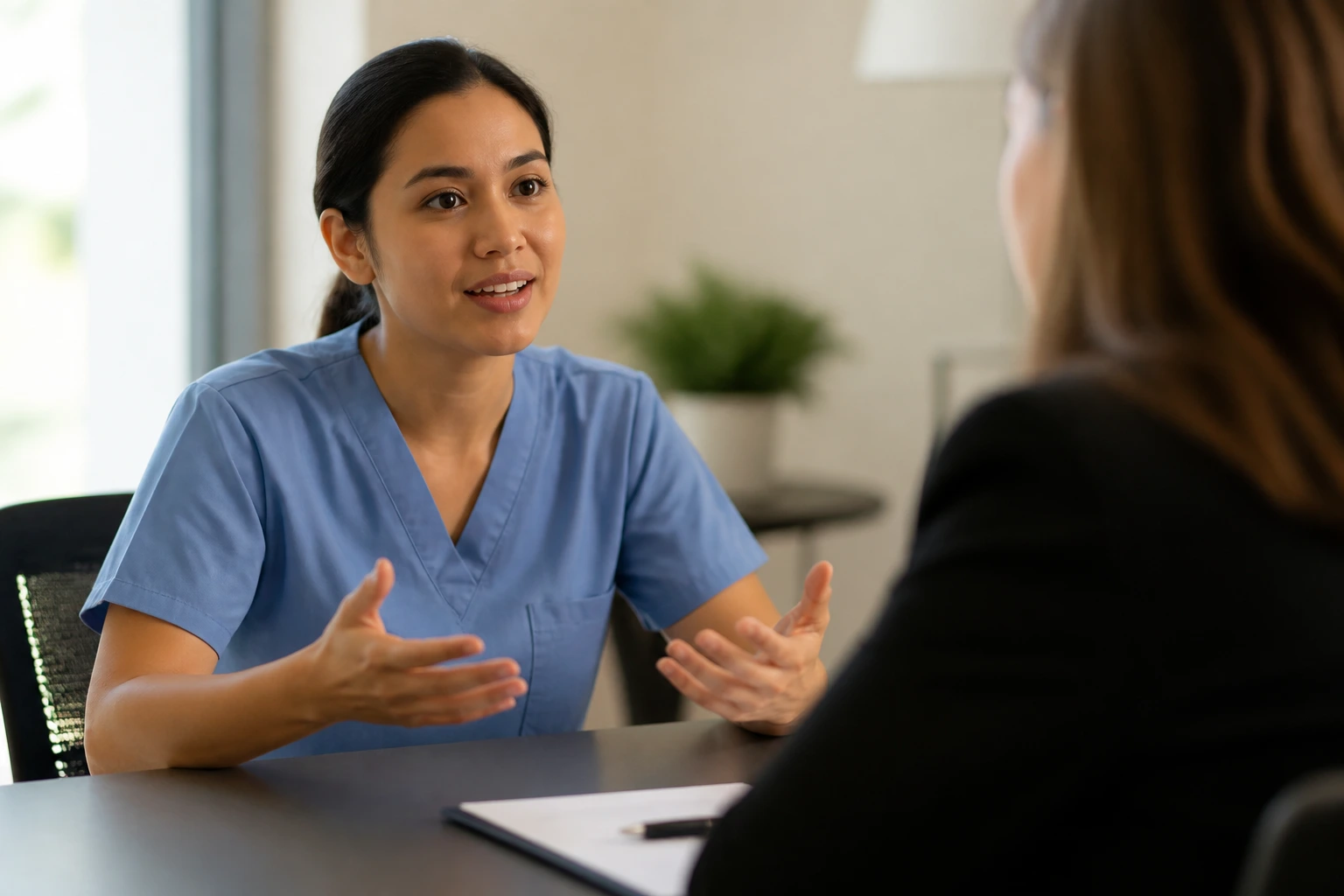 Person mid-interview questioning in a meeting room