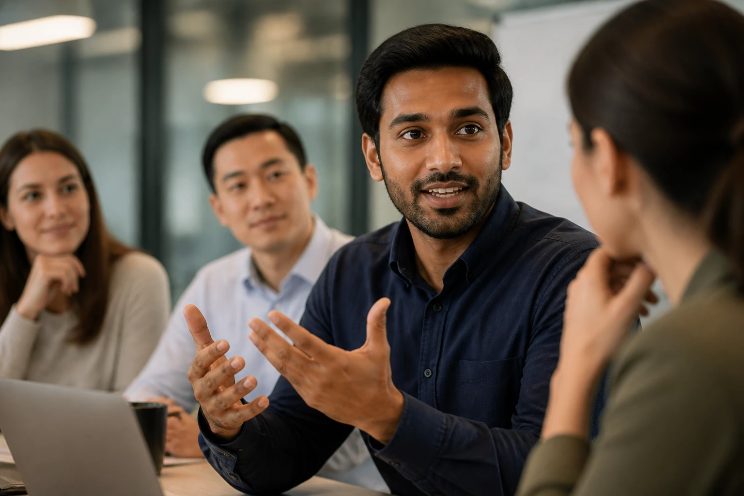 Close-up of professional speaking in a collaborative team meeting