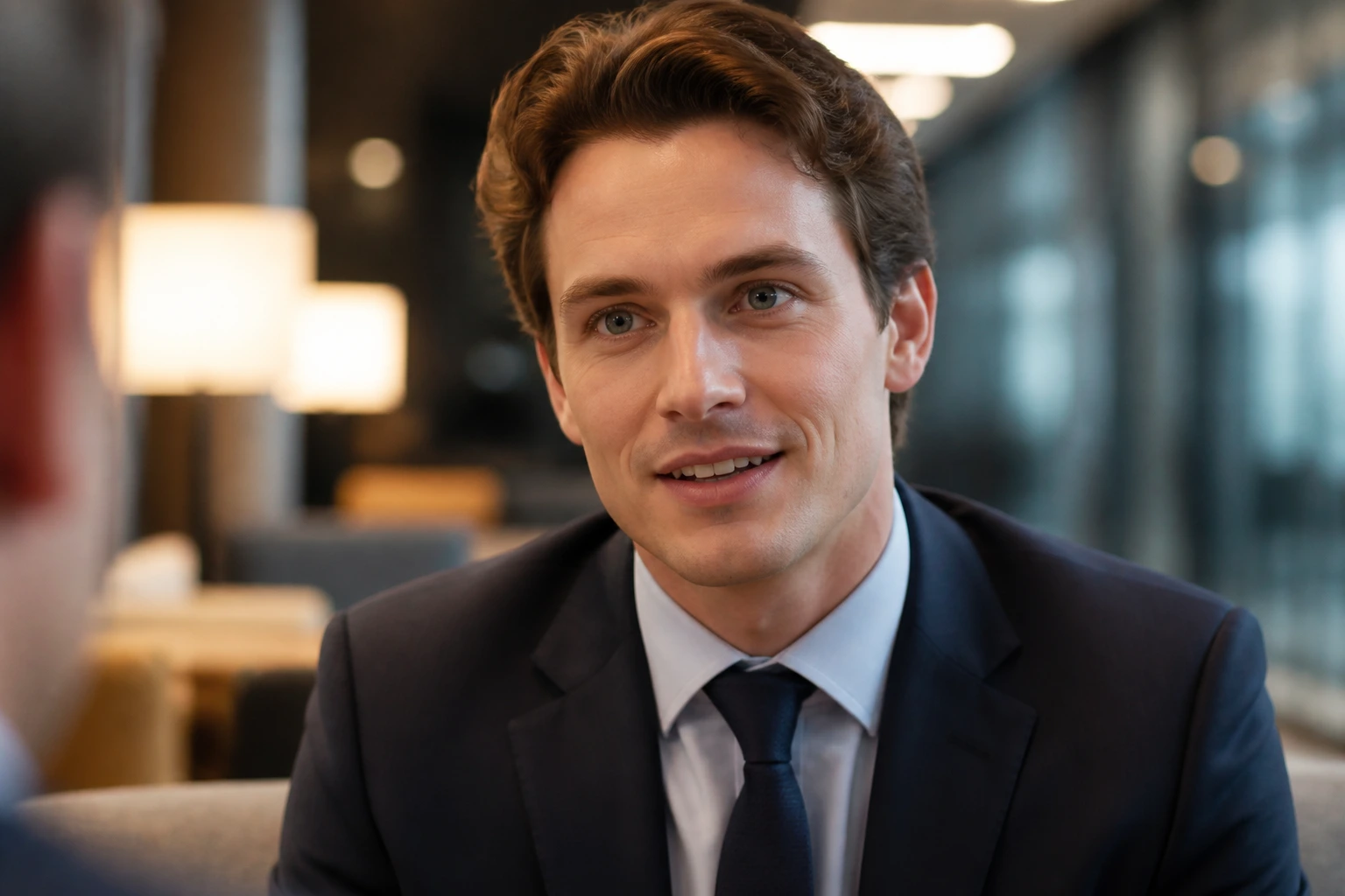 Close-up portrait of a professional with friendly expression in a relaxed office setting