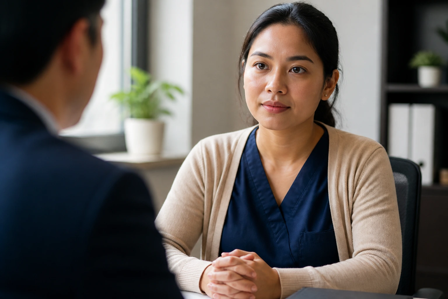 Medium close-up of a candidate during an interview about employer sponsorship
