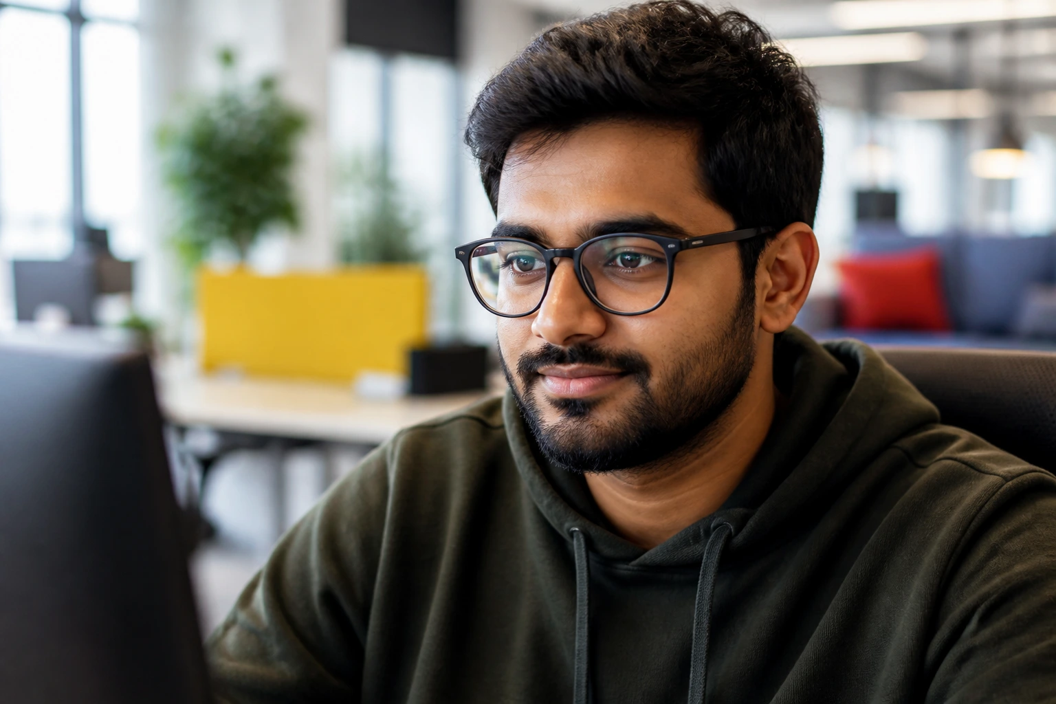 Portrait of a real engineer in a Google-inspired high-tech office