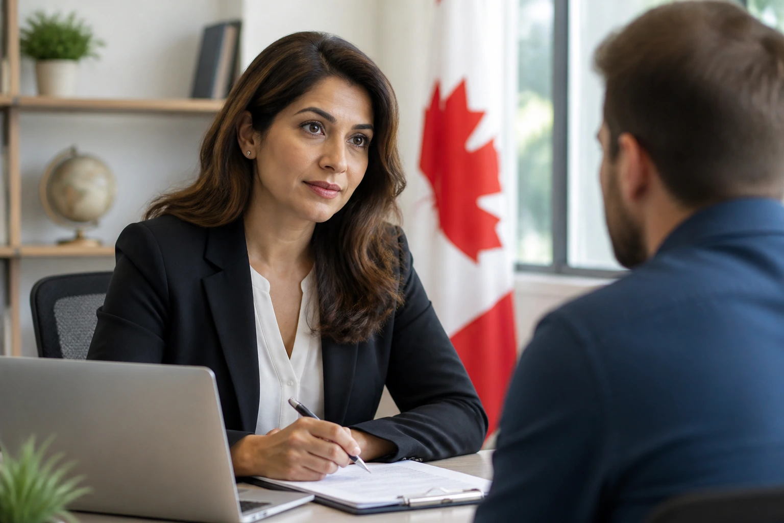 Close-up portrait of an immigration consultant in a modern Canadian office