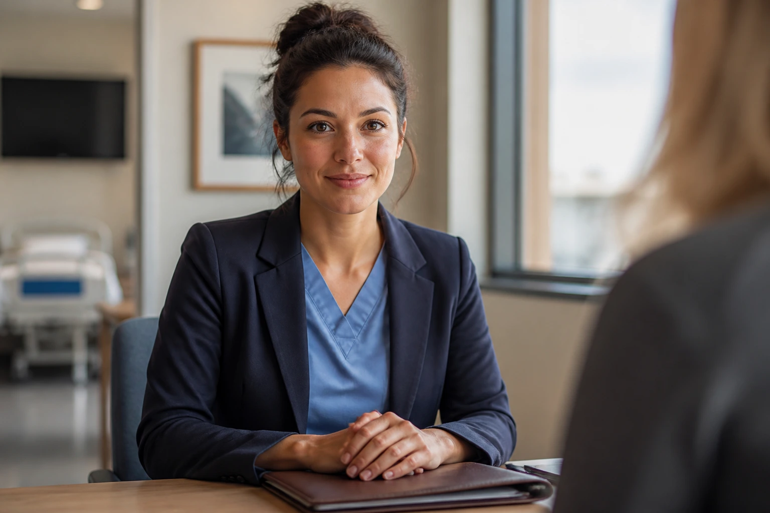 Close-up portrait of a professional midwife candidate in a hospital interview room