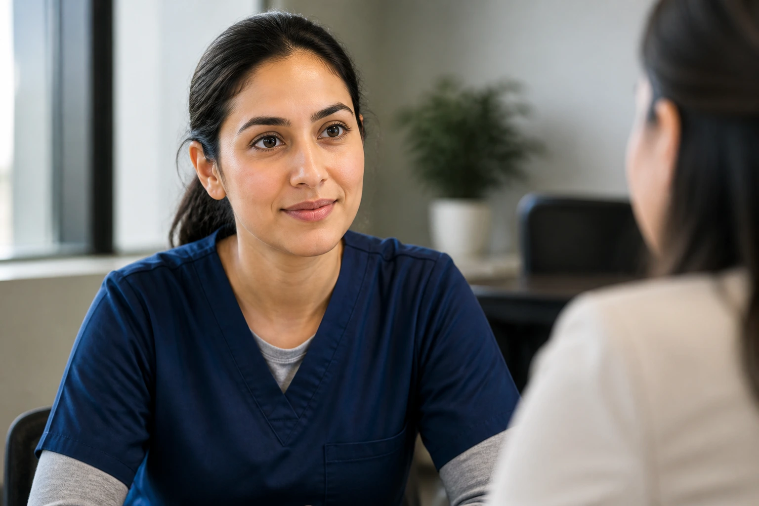 Close-up portrait of a real person in an interview setting, conveying interview process
