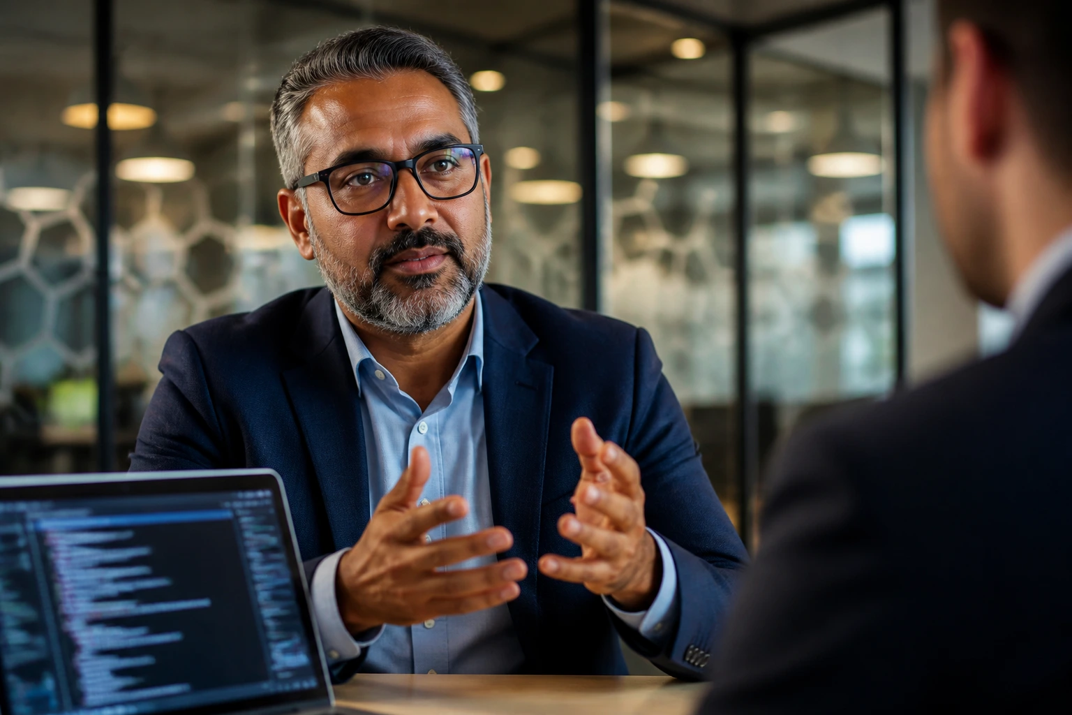 Senior cybersecurity professional preparing for interview in modern meeting room