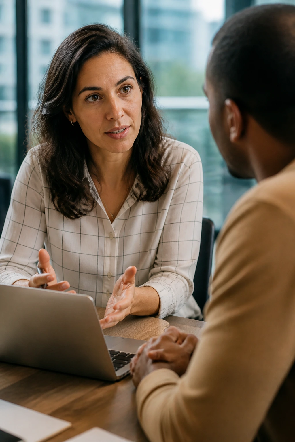 Person discussing a job offer with a colleague in an office