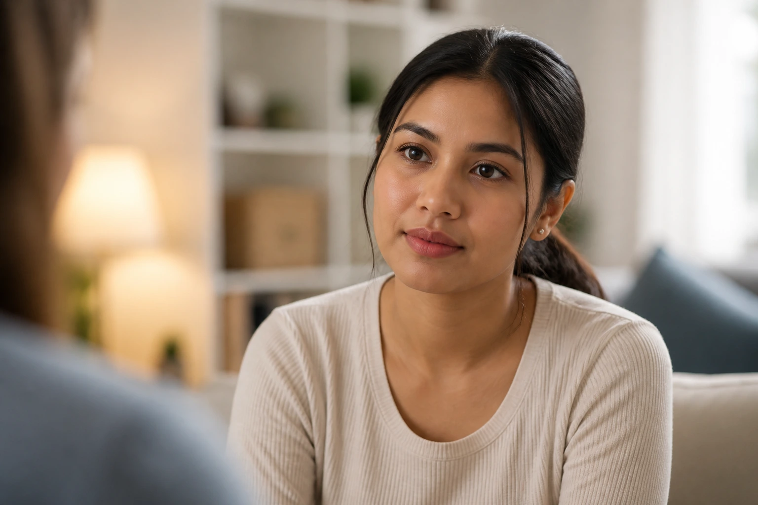Nanny candidate in a thoughtful interview pose