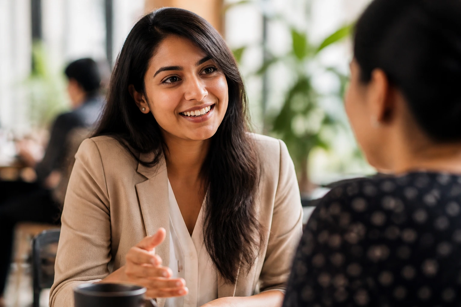 Person networking in a cafe representing international applicant networking