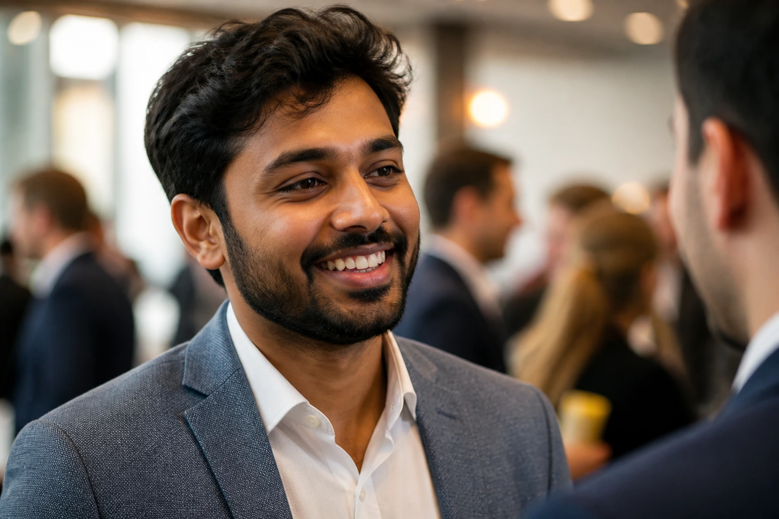 Close-up portrait of a professional networking at a conference to emphasize building your network