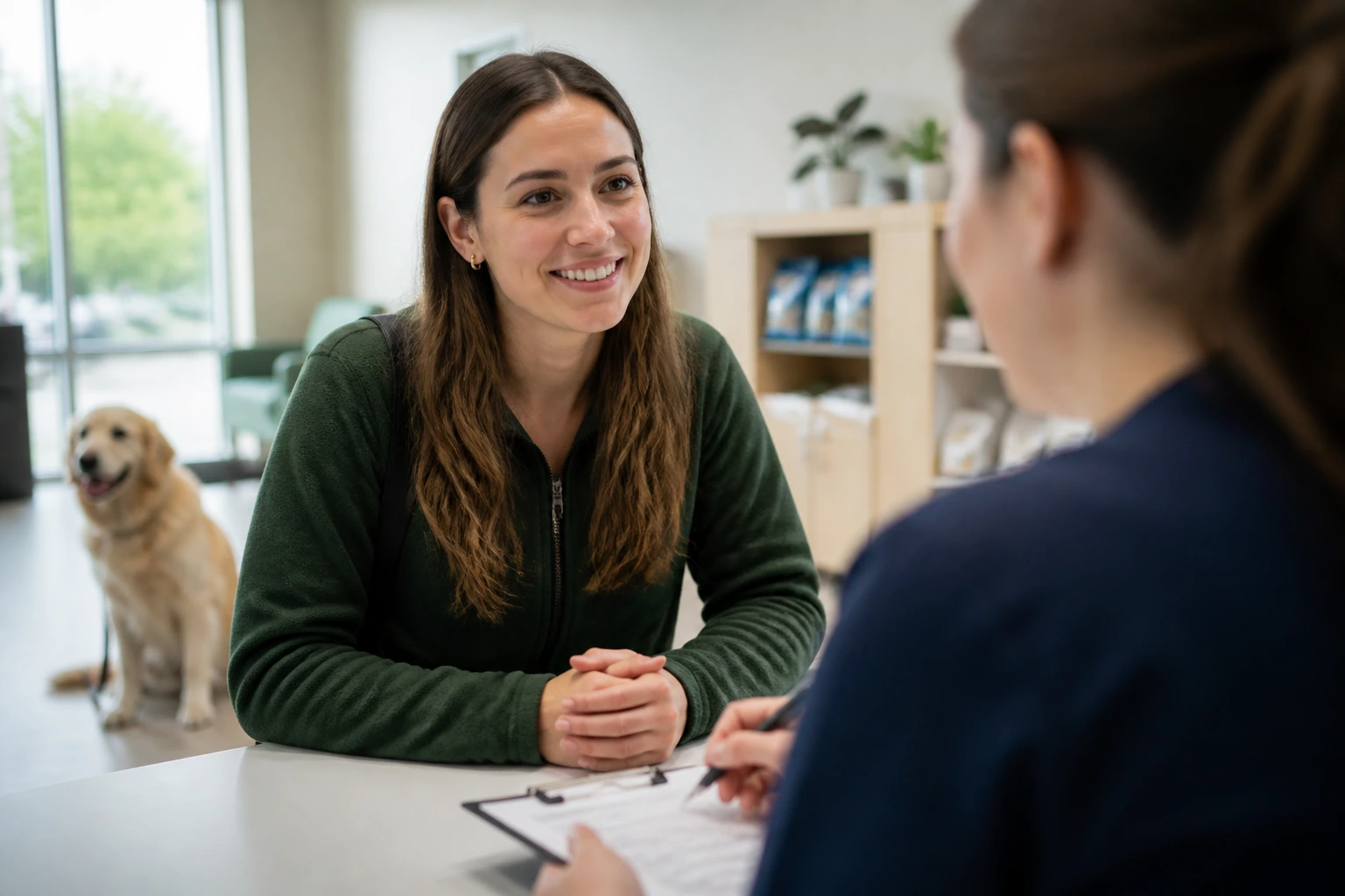 Applicant in a veterinary clinic interview setting with a dog in background