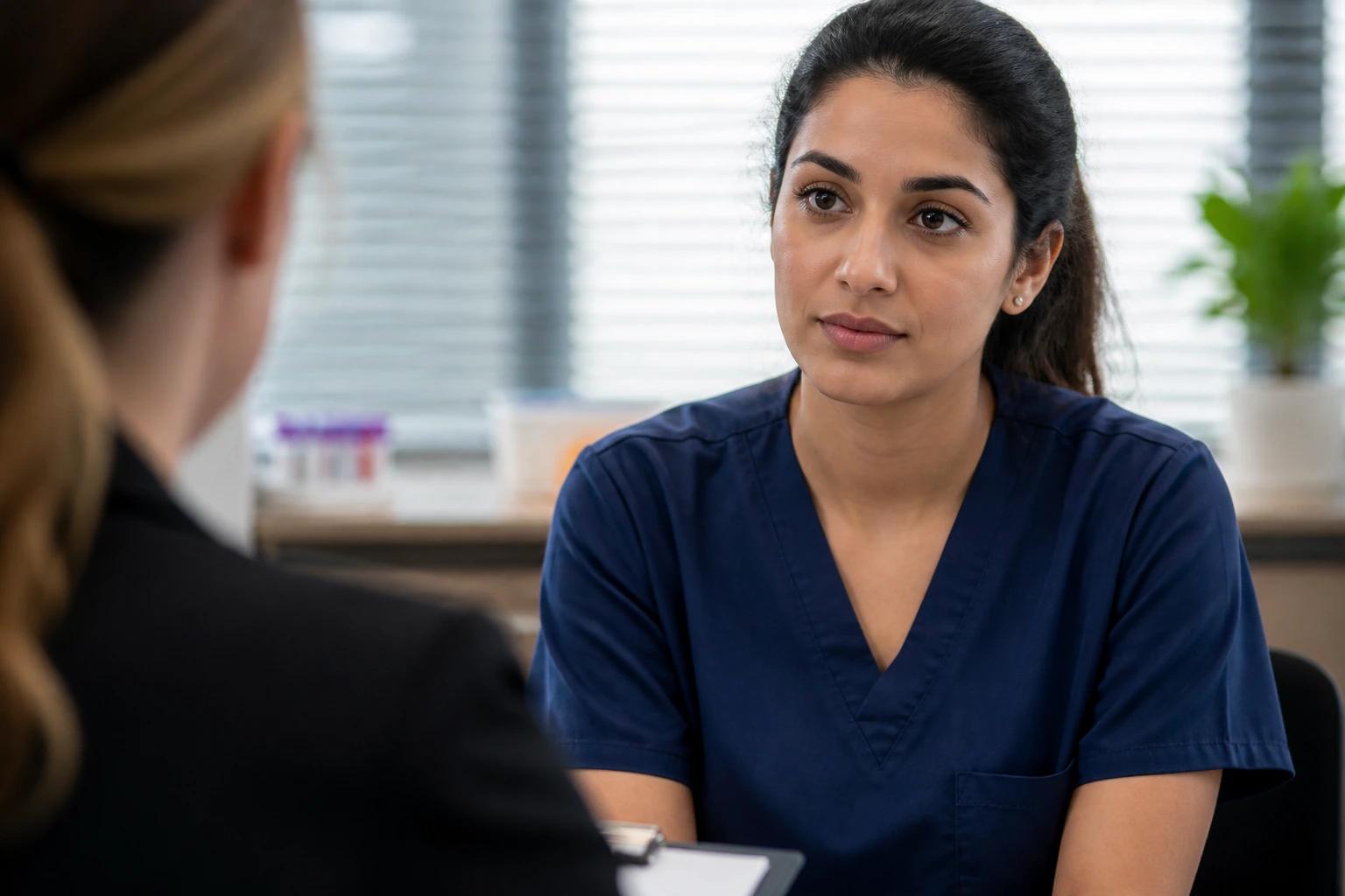 Close-up phlebotomy candidate during interview focusing on mistakes and safety