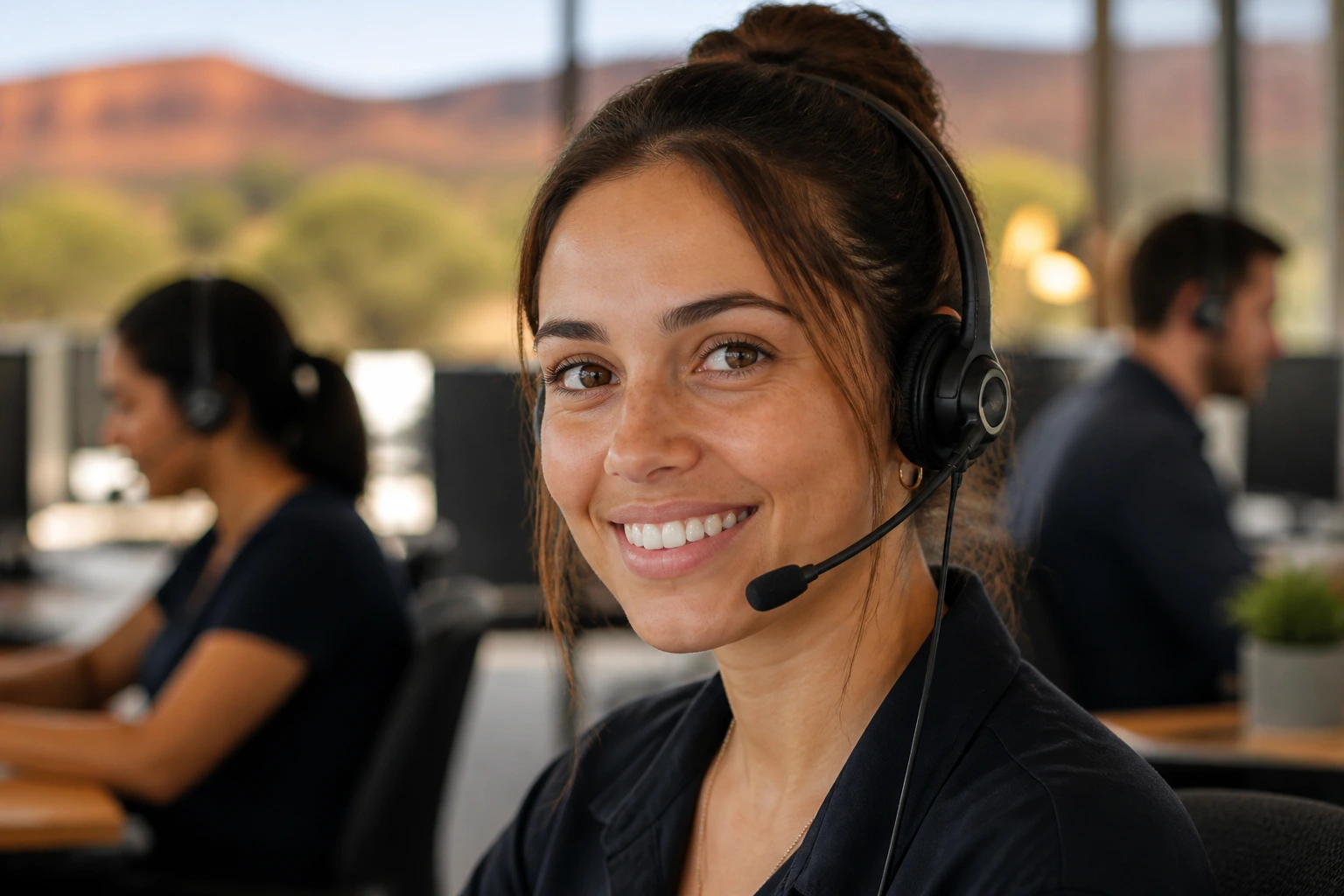 Close-up portrait of a regional Australian call centre agent wearing a headset in a regional office