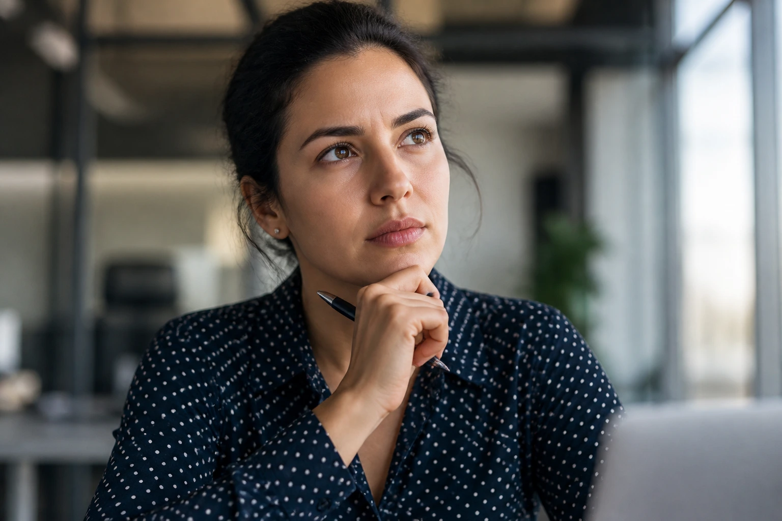 Portrait of job seeker evaluating sponsorship capability in an office