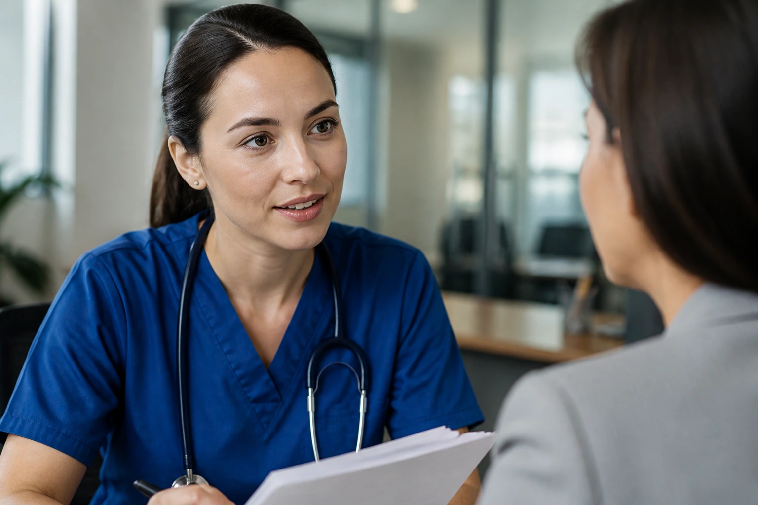 Nurse portrait in an HR office depicting visa sponsorship considerations