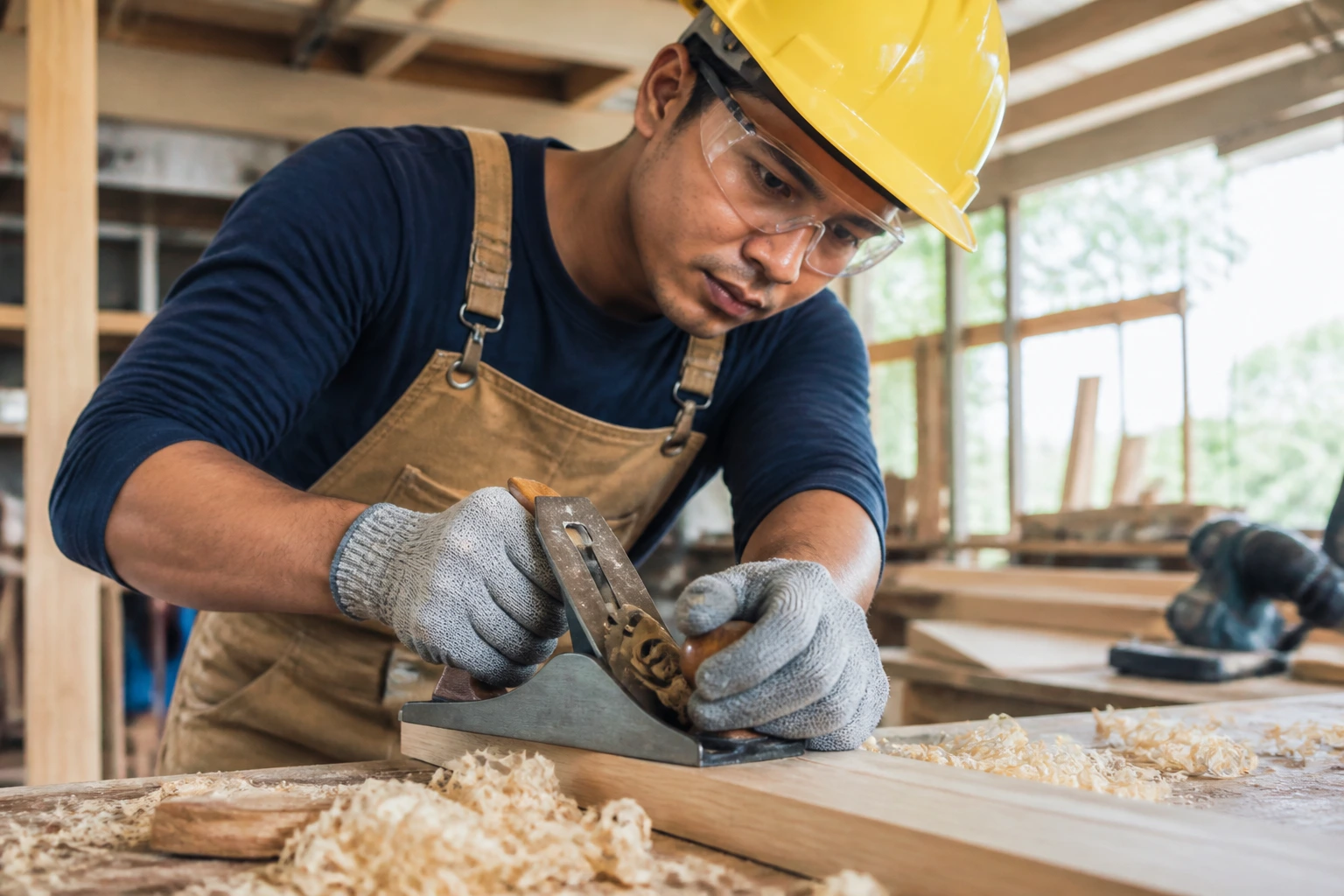 Person in PPE in workshop working on a project