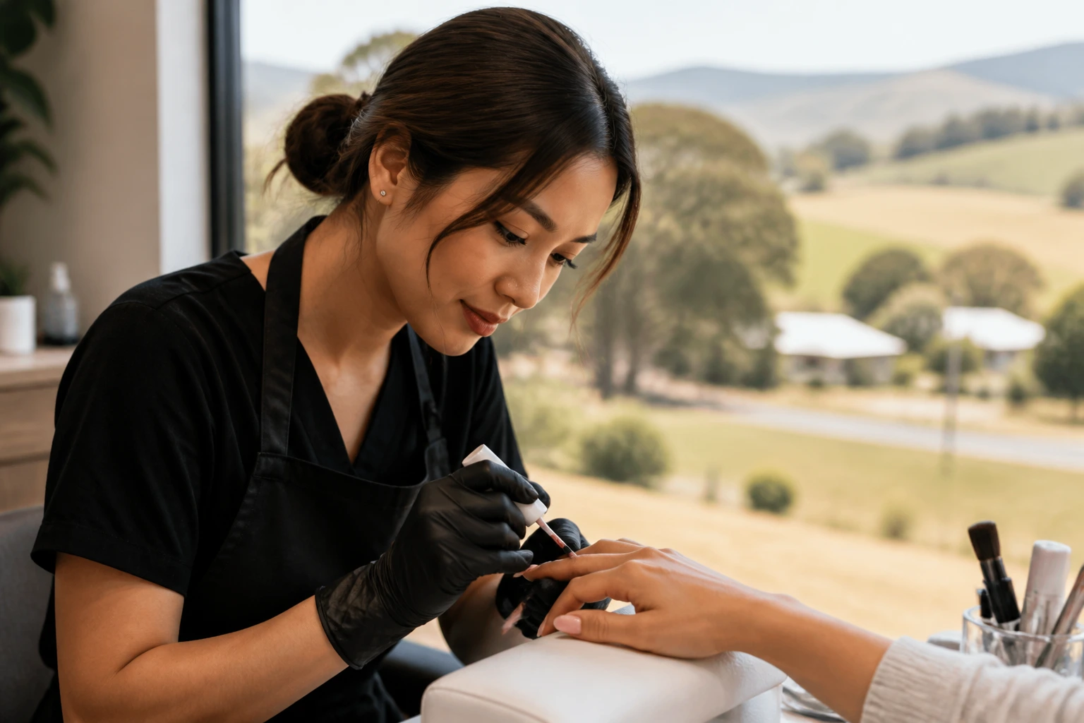 Regional nail salon scene with a technician at work in warm daylight, regional setting.